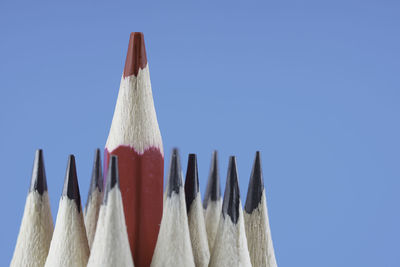 Close-up of pencils against blue background