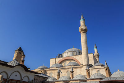 Low angle view of mosque against blue sky