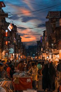 High angle view of buildings in city at sunset