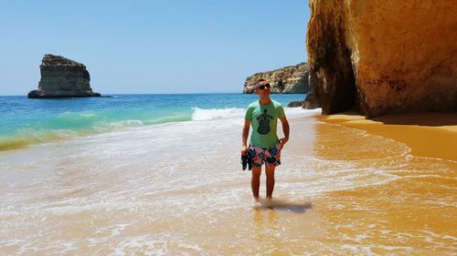 Woman standing on beach