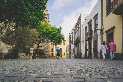 People walking on street in city