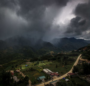 Scenic view of mountains against cloudy sky