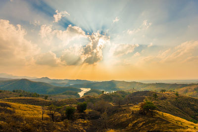 Scenic view of landscape against sky during sunset