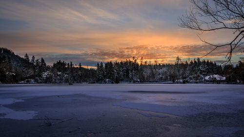 Scenic view of landscape against sky during winter