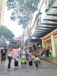 People walking on street in city