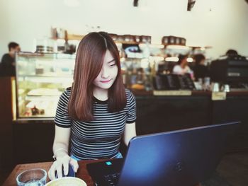 Young woman using smart phone