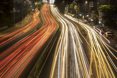 High angle view of light trails on road at night