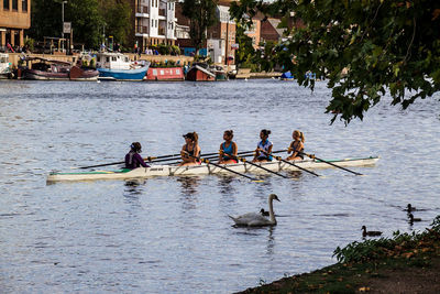 Group of people on boat in river