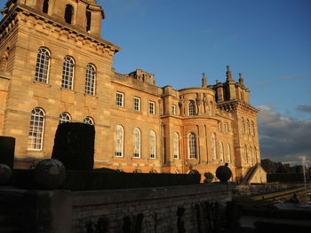 Low angle view of historic building against clear blue sky