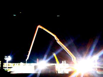 Illuminated ferris wheel against sky at night