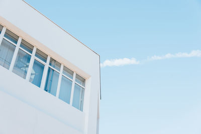 Low angle view of building against blue sky