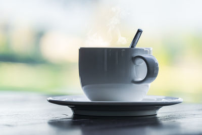 Close-up of coffee cup on table