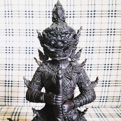 Low angle view of statue against building