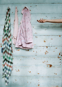 Low angle view of girl hanging on wall