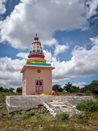 View of tower of building against cloudy sky