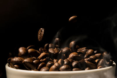 Close-up of coffee beans in background