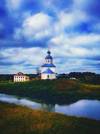 Lighthouse against cloudy sky