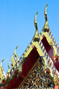 Low angle view of statue against clear blue sky