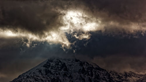 Low angle view of majestic mountain against sky