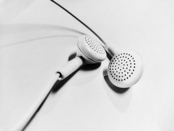 High angle view of electric bulb against white background