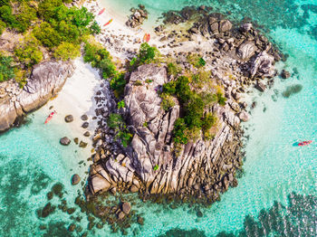 High angle view of rock formations in sea