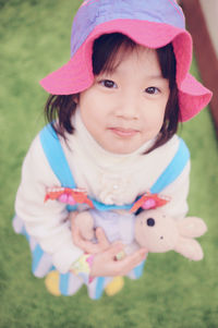 Portrait of cute girl with pink face