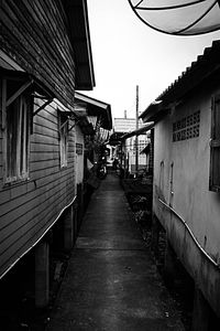 Empty alley amidst buildings in city