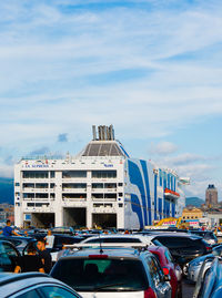 Buildings in city against sky