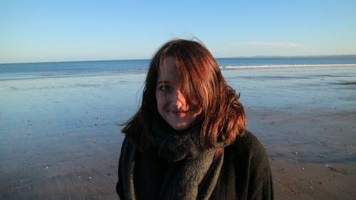 Portrait of beautiful young woman at beach