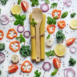 High angle view of pasta and vegetables on table