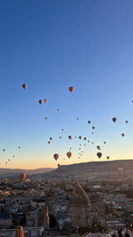 Low angle view of hot air balloons against clear sky