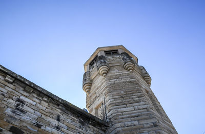 Historical abandoned prison tower and wall