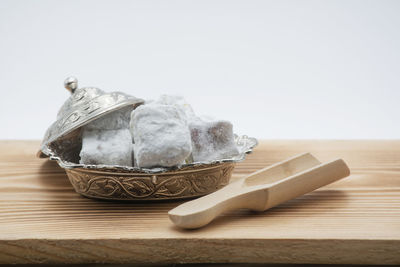 Close-up of food on cutting board against white background