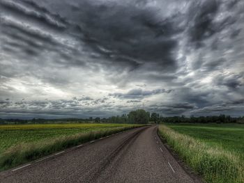 Road passing through field