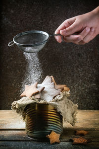 Midsection of person preparing food on table
