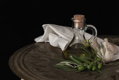 Close-up of drink on table against black background