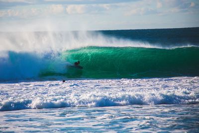 Bodyboarder riding wave