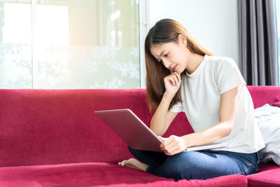 Young woman using mobile phone