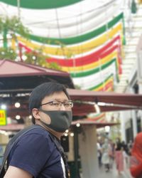 Portrait of young man wearing mask