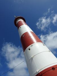 Low angle view of tower against blue sky