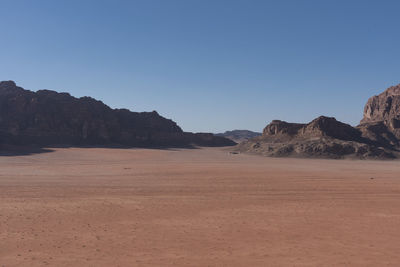 Scenic view of desert against clear sky