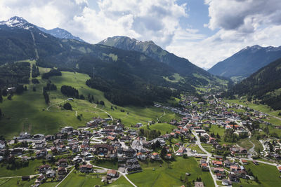 High angle view of townscape and mountains against sky