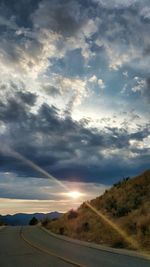 Scenic view of landscape against cloudy sky