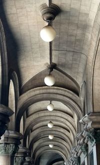 Low angle view of illuminated lights hanging on ceiling