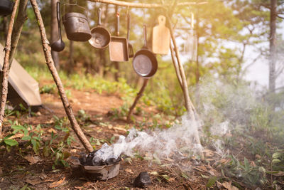 Camping concept, starting campfire with fire starting tools,cooking.