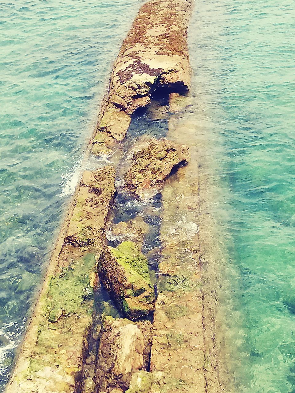 water, sea, high angle view, nature, day, outdoors, sunlight, rippled, rusty, pier, wood - material, tranquility, rock - object, no people, beach, metal, old, river, railing, shore