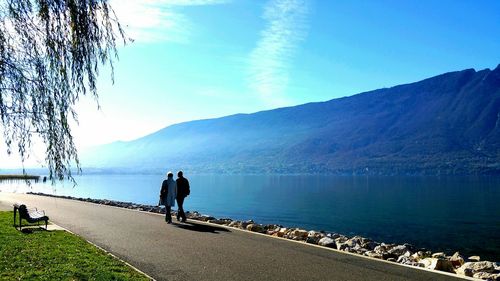 Scenic view of lake and mountains against sky