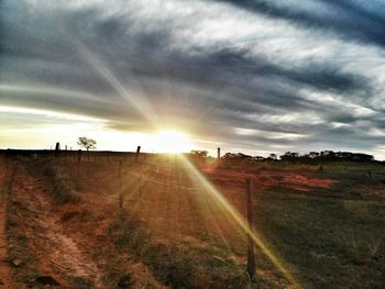 Scenic view of landscape against cloudy sky