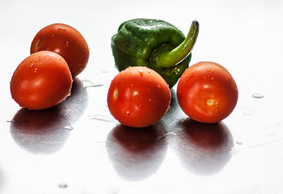 Close-up of tomatoes against white background