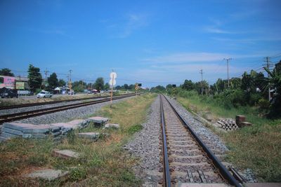 Railway tracks against blue sky